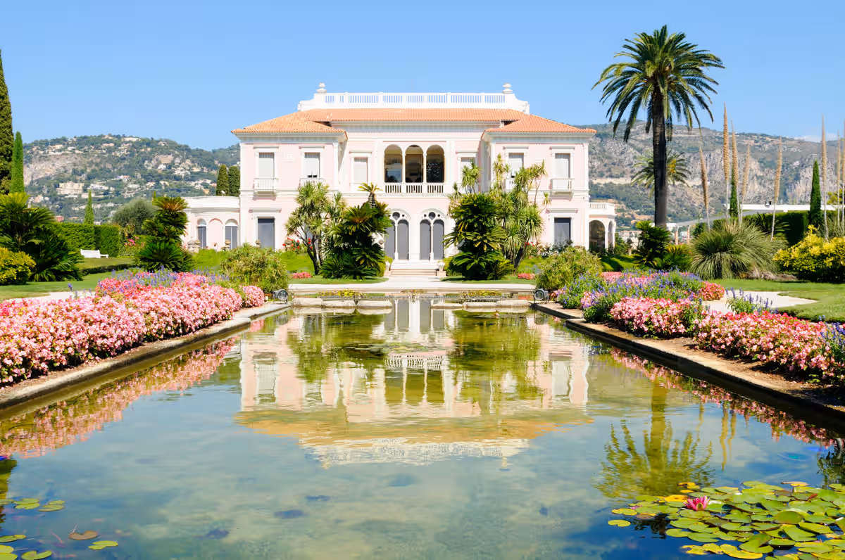 Mediterranean home reflected in a still pool